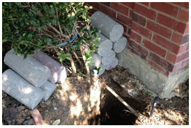 Fort Worth installation of concrete piers under a foundation.