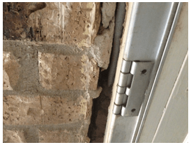 Cracks Between Doors and Brick