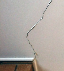 Foundation settling causes drywall cracks.