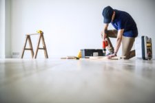 A photo of a man doing DIY foundation repair