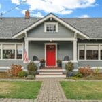 texas home painted haint blue with a porch and clear aligned windows and doors