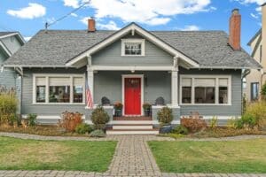 texas home painted haint blue with a porch and clear aligned windows and doors